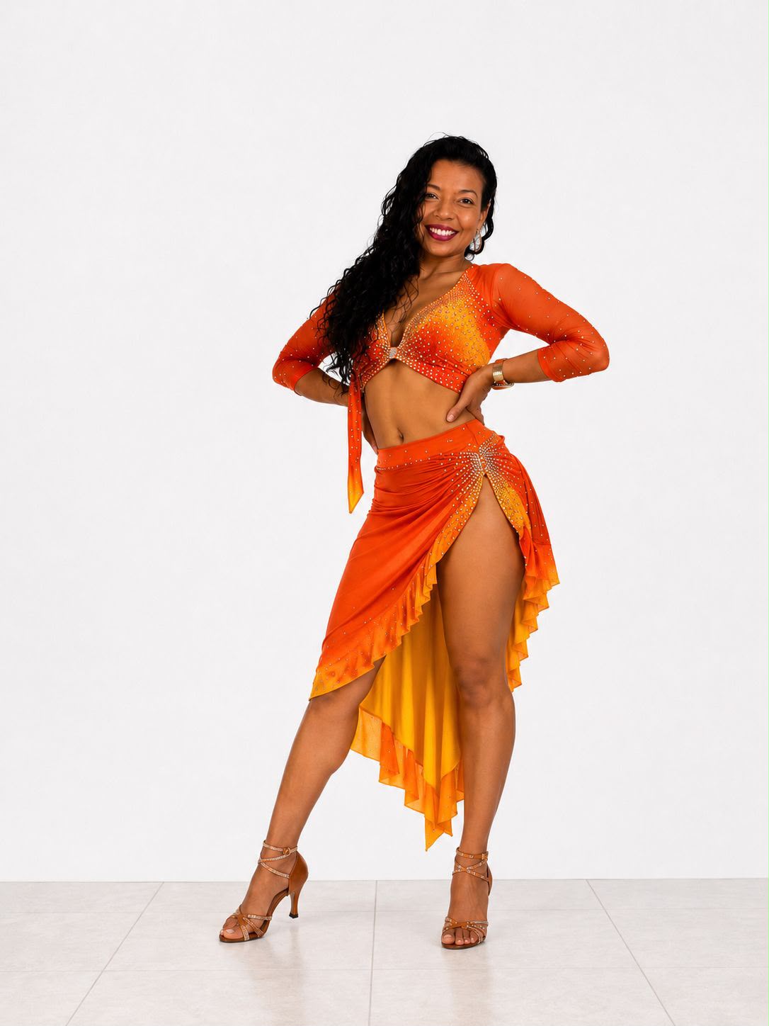 Mary Villa posing in an orange dance costume.